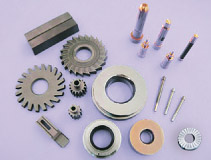 Wear-resistant dies, tools, and powder feed contact